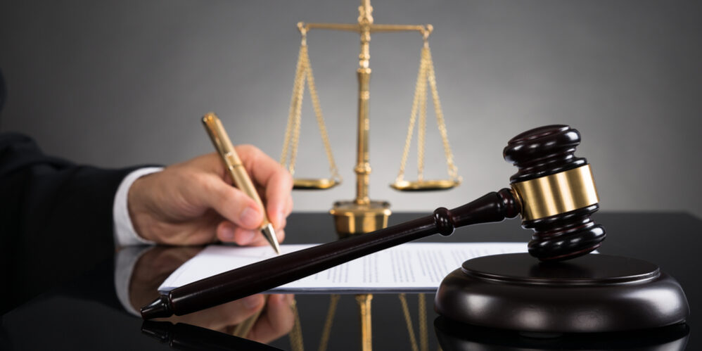 Judge Writing On Paper At Desk Recent Updates to New Jersey's Family Leave Act and What They Mean for You