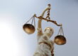 A statue of Lady Justice holding scales, symbolizing fairness and the enforcement of wage and hour laws in New Jersey.