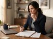 Employee carefully reviewing a severance agreement and release of employment claims before signing.